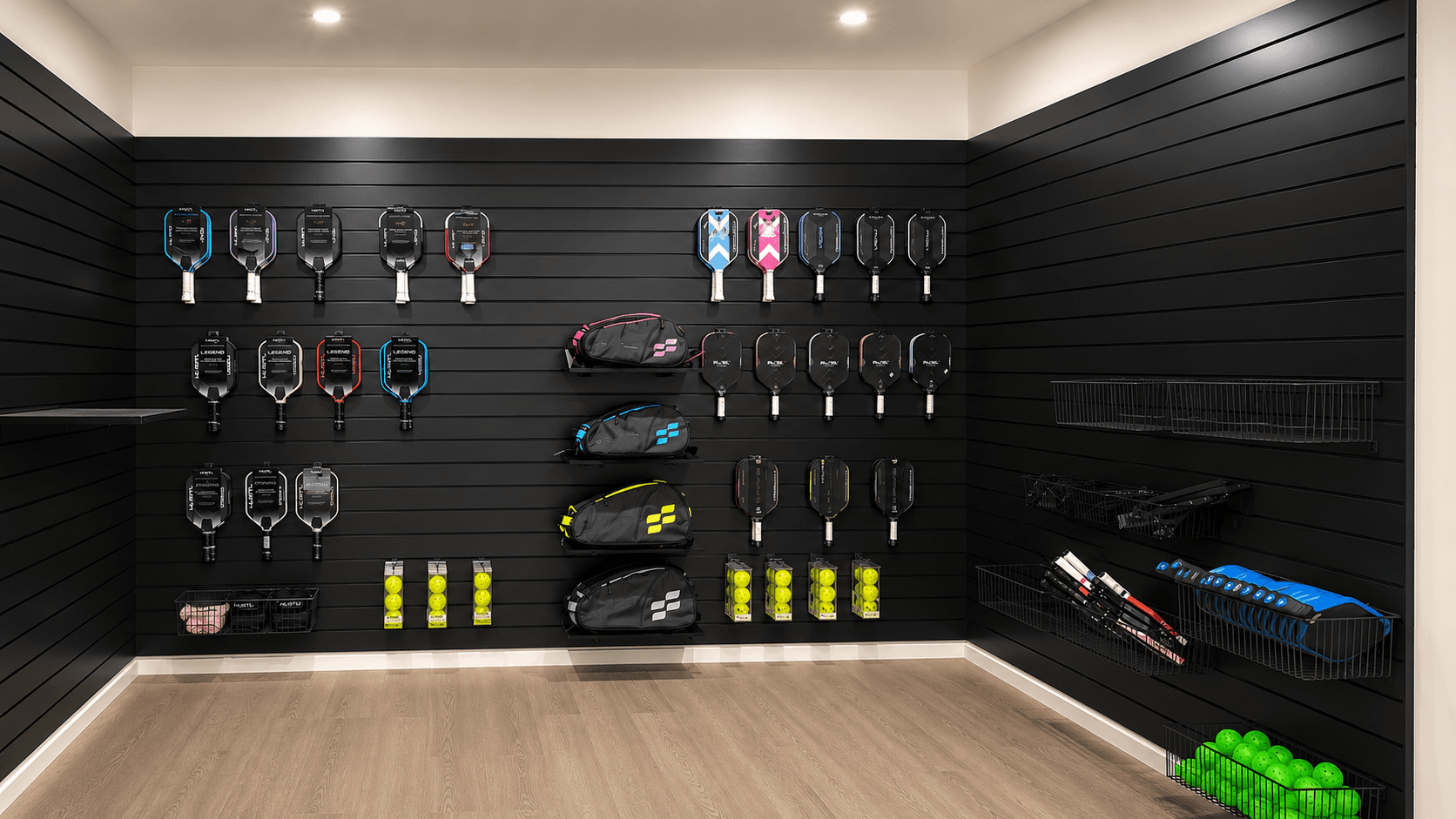 Pickle4Real pro shop with paddle display, apparel racks, and refreshment fridge