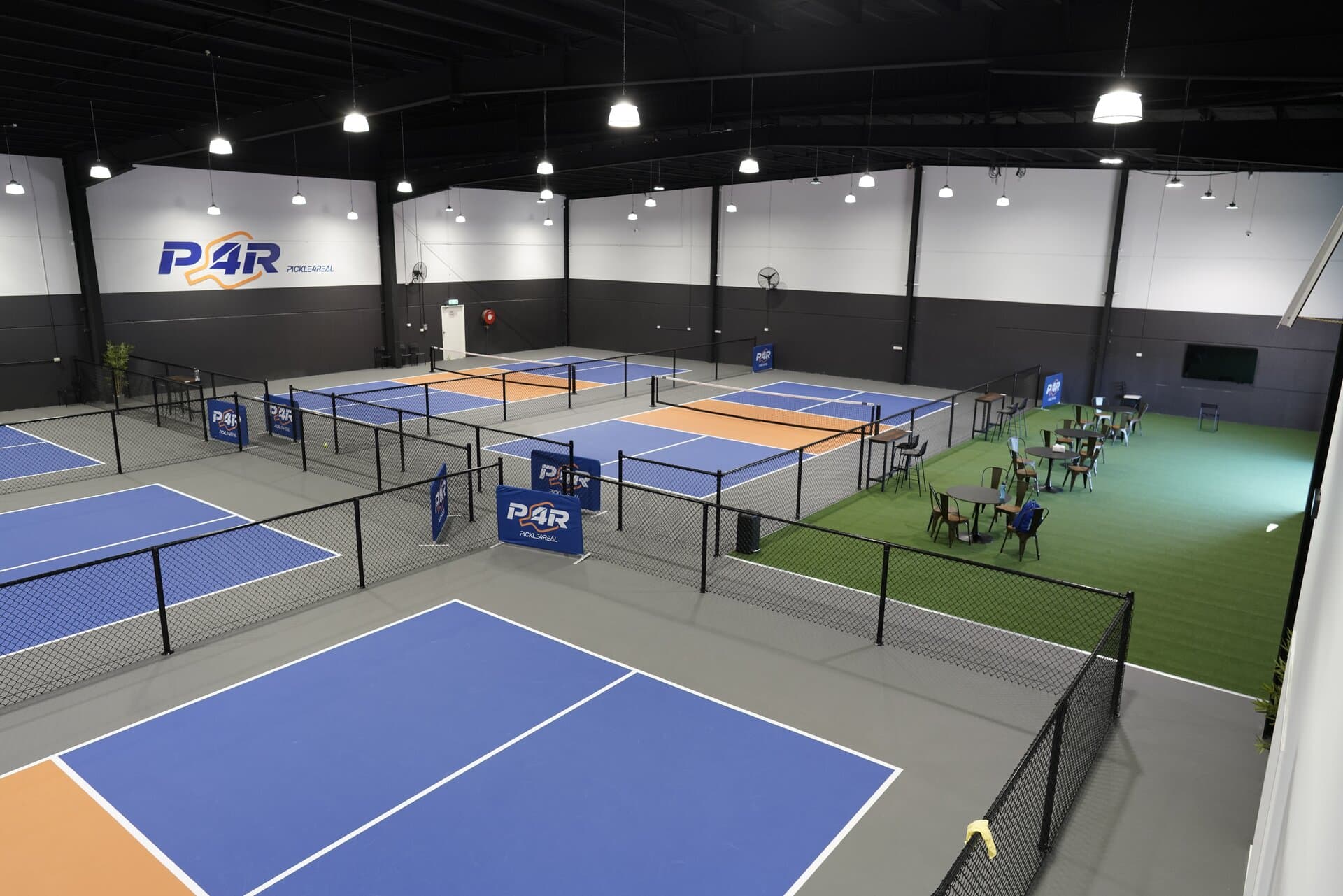 Competitive players rallying on an indoor court